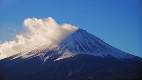 Rolling clouds over Mt.Fuji at sunset, Kawaguchiko, Japan Stock Footage 128900618