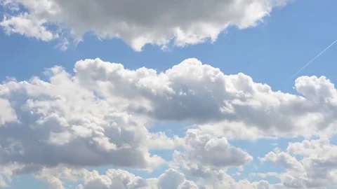 Rolling clouds in a sunny day 4k time-lapse Stock Footage