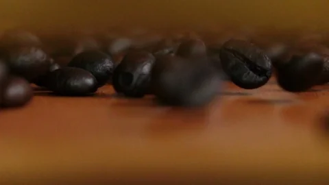 Rolling coffee beans in slow motion shot 스톡 동영상 104793074