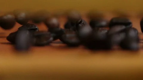 Rolling coffee beans in slow motion shot Video stock 104793469