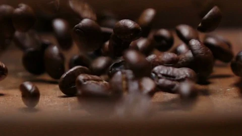 Rolling coffee beans in slow motion shot Stock Footage 104808081