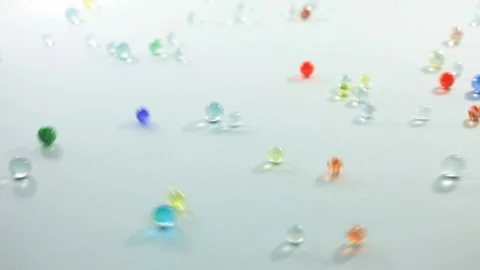 Rolling Colorful Marbles Stock Footage 332508915