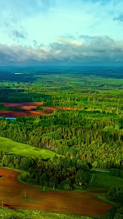 Rolling Countryside Beneath Dramatic Cloud Shadows Stock Footage 328737088