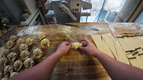 Rolling croissants from dough triangles Stock Footage 328605422