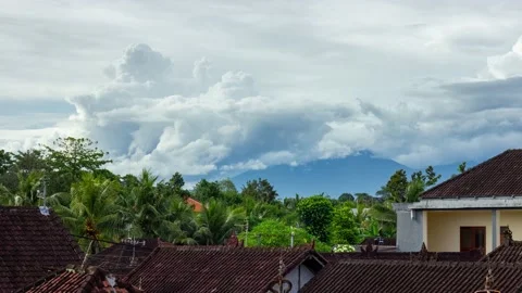 Rolling Cumulus Clouds Over the Mount Batukaru from Ubud, Bali Time Lapse Stock Footage 199594658