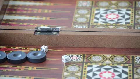 Rolling dice on backgammon board Stock Footage 130460887