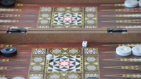Rolling dice on backgammon board Stock Footage 130460903