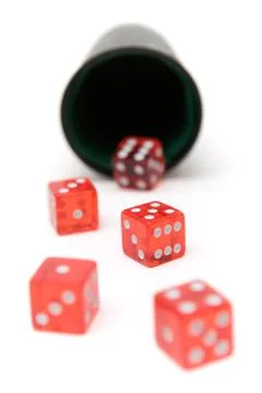 Rolling the Dice Isolated on a White Background Photos