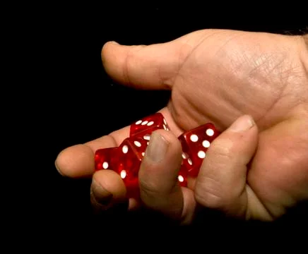 Rolling dice Stock Photos