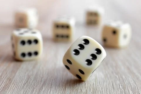 Rolling dice Stock Photos