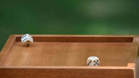 Rolling dice with a shallow depth of field and copy space Stock Footage 94643299