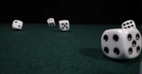 Rolling dice in slow motion. Dices falling to green table. Gambling and casino Stock Footage 172244044