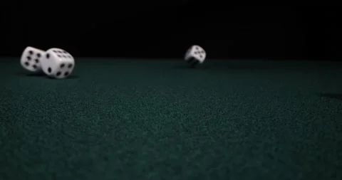 Rolling dice in slow motion. Dices falling to green table. Gambling and casino Stock Footage 172351442