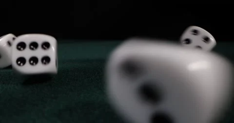 Rolling dice in slow motion. Dices falling to green table. Gambling and casino Stock Footage 172351451