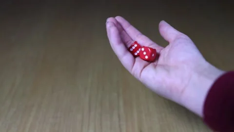 Rolling dice on table playing board game, close up hands Stock Footage 169704608