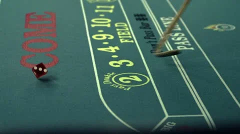 Rolling die on a craps table and the craps stick. Stock Footage 8975819