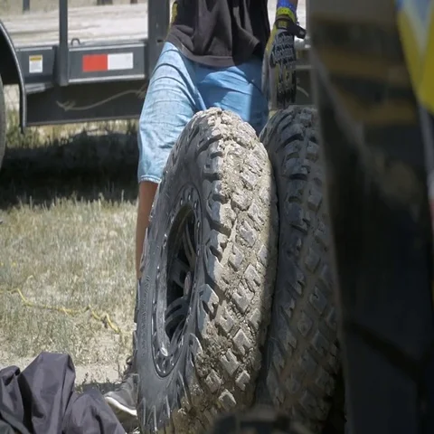 Rolling Dirty UTV Wheel and Tire in Slow Motion Stock Footage 69695207