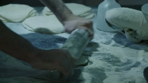 Rolling the dough for baking the bread Stock Footage 129016579