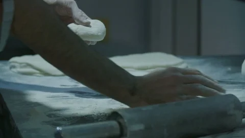 Rolling the dough for baking the bread - slow motion Stock Footage 129016577