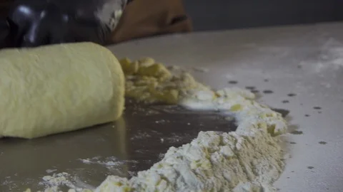 Rolling dough for bread in slow motion Stock Footage 127855353