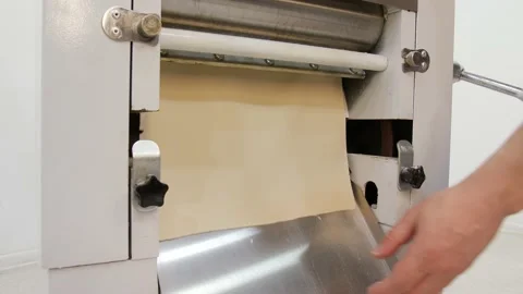 Rolling dough machine. Making dough for pasta Stock Footage 131824951