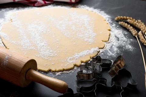 Rolling dough with roller. Stock Photos