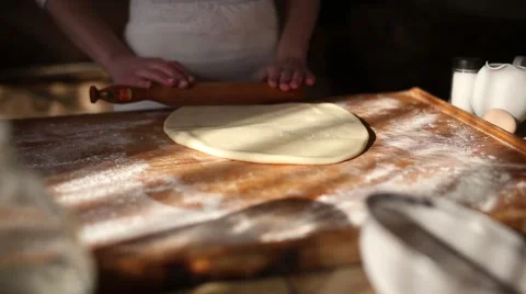 Rolling dough with rolling pin for baking Stock Footage 61581754