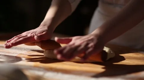 Rolling dough with rolling pin for baking Stock Footage 61581778