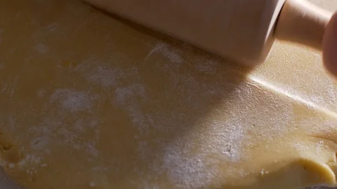 Rolling a dough with a rolling pin Stock-Footage 104432668
