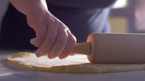 Rolling a dough with a rolling pin Slow motion Stock-Footage 104432806
