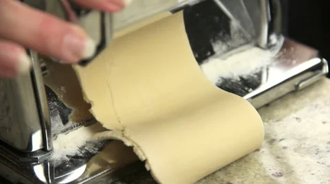 Rolling Dough Through Pasta Maker Stock Footage 40025879