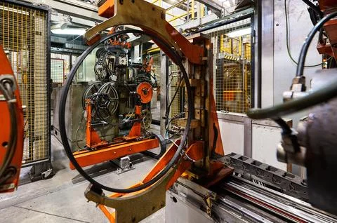 Rolling drum with rubber layers to form car tire at plant Stock Photos