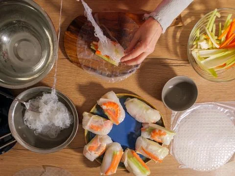 Rolling fresh spring rolls with rice noodles and vegetables Stock Photos