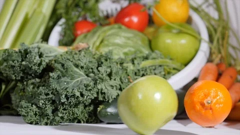 Rolling Fruit with Fruit and Vegetable Background Stockbeeldmateriaal 105139255