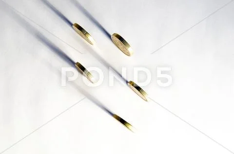 Rolling golden coins Stock Photos