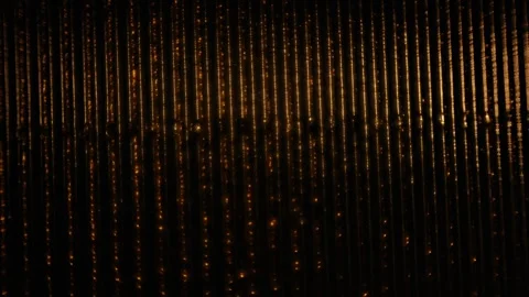 Rolling golden light over vertical lines on a black abstract background for.. Stock Footage 340034550