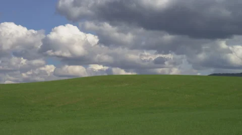 Rolling Green Hills with Dramatic Storm Clouds Stock Footage 35272437