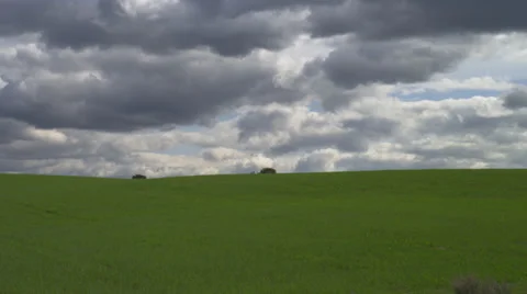 Rolling Green Hills with Dramatic Storm Clouds Stock Footage 35273220