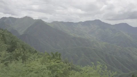 Rolling Green Mountains Under Cloudy Sky Stock-Footage 343555293