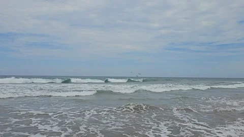 Rolling Grey Surf and Distant Paraglider, Punta Sal, Peru 8K Stock-Footage 331482700