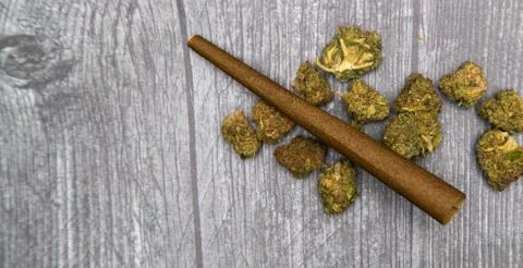 Rolling A Hemp Wrap With Marijuana Stock Photos