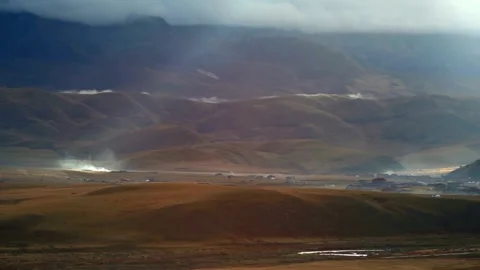 Rolling hills and mountains create a scenic rural landscape Stock Footage 311819717