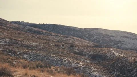 Rolling hills covered with light snow 스톡 동영상 346007396