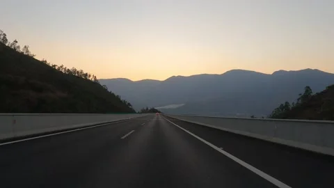 Rolling hills dusk road Stock Footage 203994485