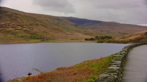 Rolling Hills By Lake Stock Footage 75547127