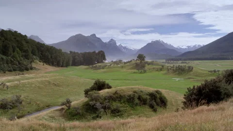 Rolling hills with mountain background Stock Footage 159797746