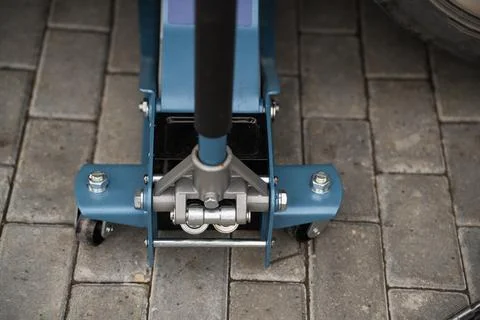 Rolling jack under the car Stock Photos