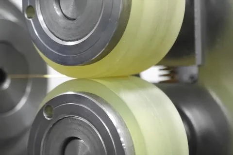 Rolling machine for rolling gold into, thin wire. Stock Photos