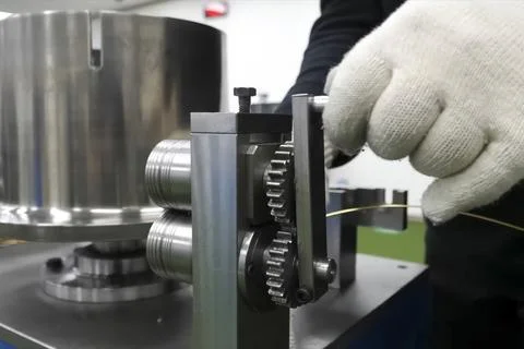 Rolling machine for rolling gold into, thin wire. Stock Photos