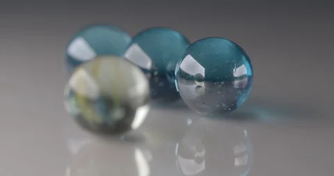 Rolling marbles close up footage Stock Footage 115074892